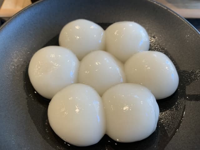 53077